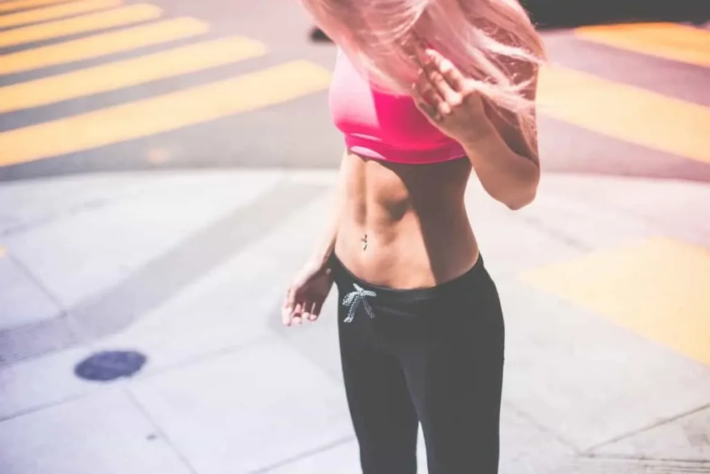 Woman with toned stomach after LA-EMS Body Sculpting Treatment Lower Feltham 