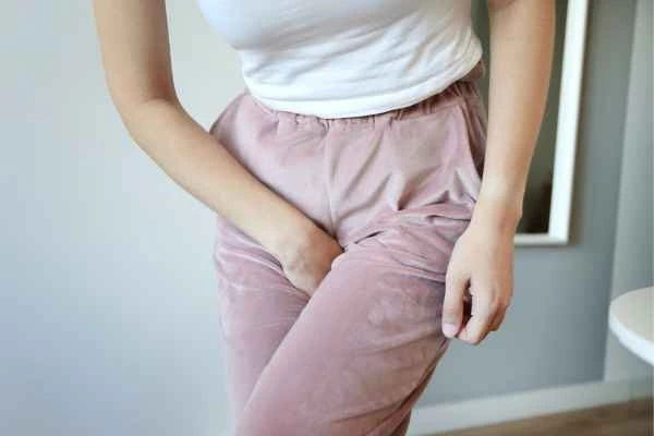 woman running for the toilet because of urinary incontinence Lower Feltham